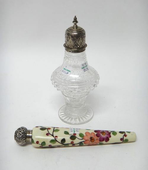 A silver mounted faceted glass sugar caster, the top with floral engraved decoration, Birmingham 1906 and a silver mounted ceramic scent bottle of tap