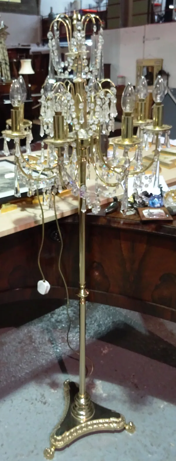 A 20th century gilt metal floor standing lamp, hung with drops.  H1