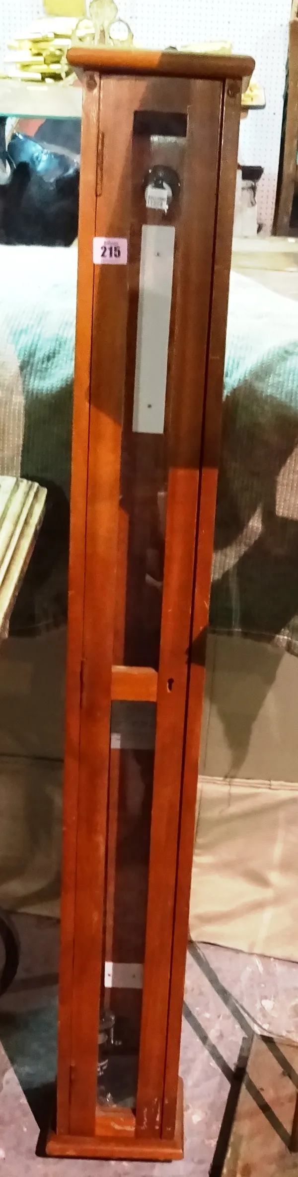 A scientific barometer, 20th century, of circular stick form, ebonised with applied thermometer, housed in a glazed mahogany case, 97cm high.  E4