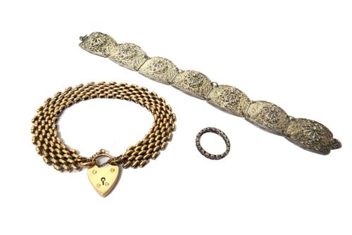 A gold decorated and plain oval link bracelet, on a 9ct gold heart shaped padlock clasp, Birmingham 1907, weight 21 gms, a filigree link bracelet and
