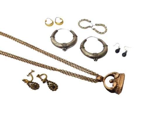 An early 19th century gold cased and cornelian set pendant fob seal, monogram engraved, a gilt metal long guard chain fitted with a swivel clasp and f