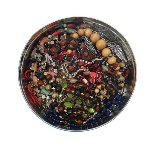 An oval link charm bracelet fitted with a variety of silver, enamelled and other charms, including a squirrel, a Highlander and a Red Indian's headdre