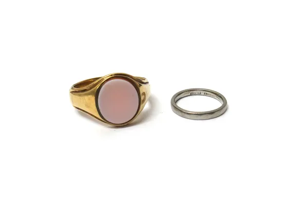A 9ct gold and oval sardonyx set gentleman's signet ring, Birmingham 1926, ring size V and a half, gross weight 7.5 gms and a platinum wedding ring, d