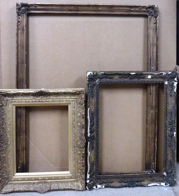 A group of three gilt plaster swept frames, the largest aperture 111cm x 84cm. (3)  CAB