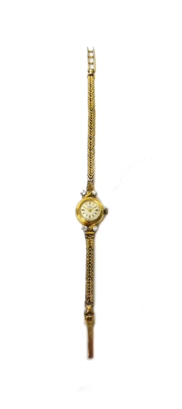 A Girard-Perregaux 18ct gold and diamond set circular cased lady's wristwatch, the signed silvered dial with gilt baton shaped numerals, the case term