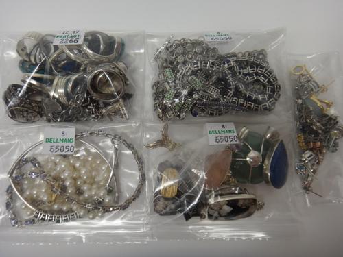 A single row necklace of cultured pearls and silver and other jewellery, comprising; thirteen rings, a charm bracelet fitted with five charms, six bra