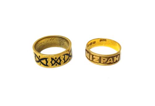 A Victorian 18ct gold MIZPAH ring, Birmingham 1874, ring size L and a half and a Victorian gold and dark blue enamelled band ring, traces of inscripti