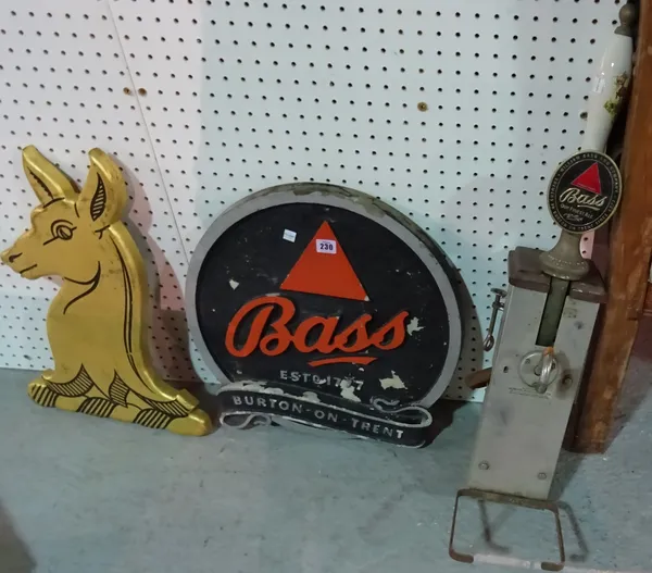 A 20th century resin 'Bass Beer' sign, a beer tap and a small gilt deer sign, (3). ROST