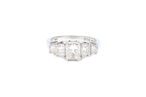 A platinum and diamond set five stone ring, mounted with a row of princess cut diamonds graduating in size to the centre stone, estimated weight of th