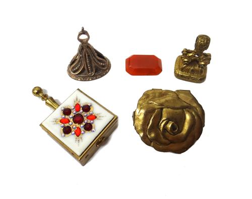 An early 19th century gilt metal mounted agate set fob seal, a gilt metal mounted pale brown paste set fob seal, a carved cornelian intaglio, with a s