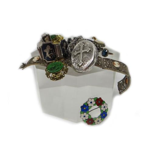 A seed pearl set and blue enamelled oval brooch, decorated with a white enamelled border, a silver and vary coloured enamel brooch, with flowerhead mo