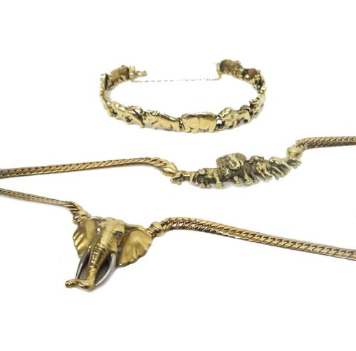 A 9ct gold necklace, the front cast with a row of African wild animals centred by an elephant, on a flat curb link neckchain, the clasp formed as an e
