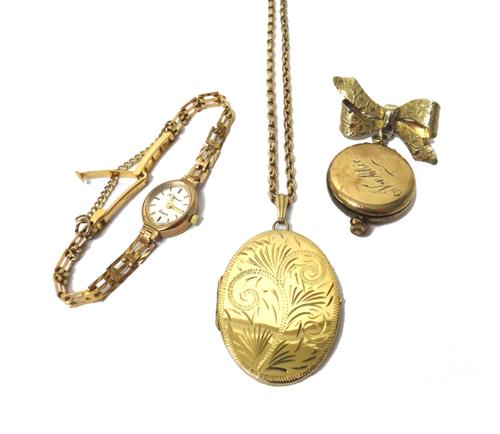 An H.Samuel Quartz 9ct gold cased lady's bracelet wristwatch, a gilt metal oval pendant locket, with engraved decoration, with a gold oval link neckch