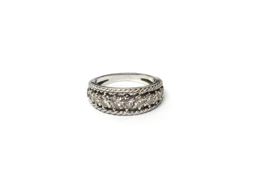 A diamond set eleven stone half hoop ring, mounted with a row of circular cut diamonds graduating in size to the centre stone, between ropetwist pierc
