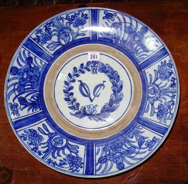 A 17th century style large blue and white plate with VOC monogram. C4