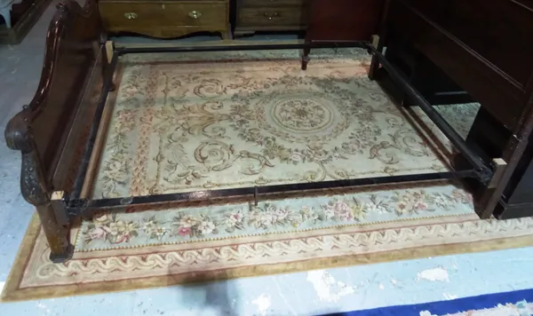 A large Chinese carpet in the Aubusson style with central motif and wide borders, peach ground, 246cm x 310cm.  K9