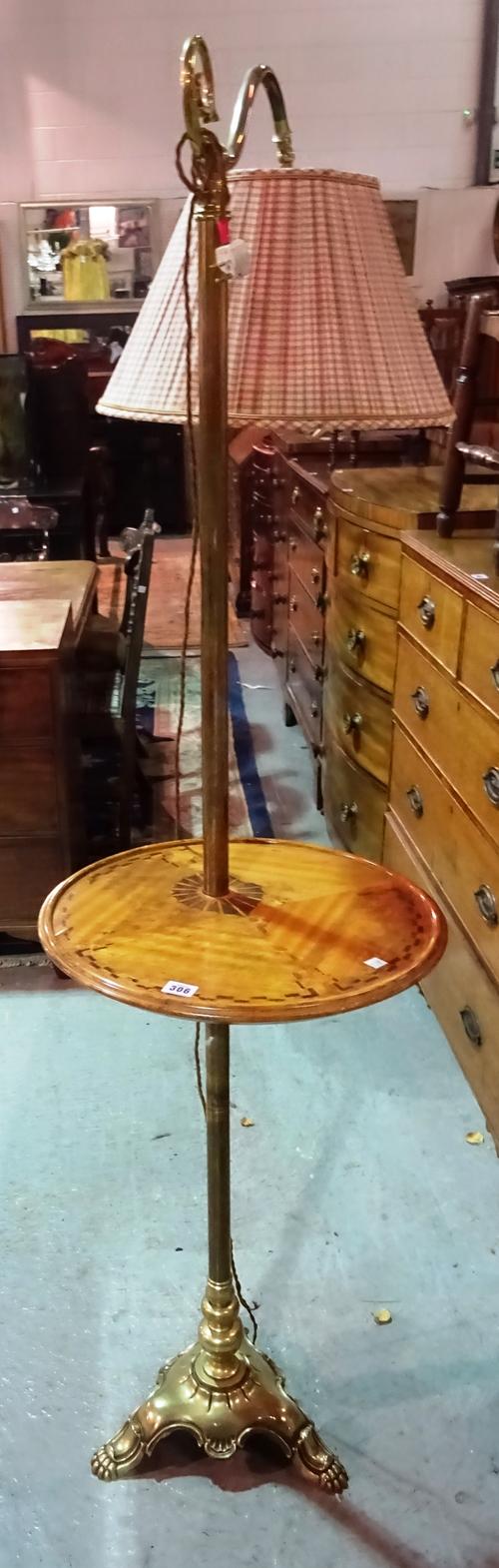 An early 20th century brass standard lamp with integral central wooden table.  K7