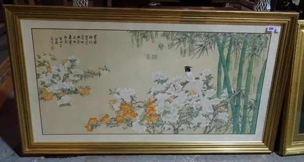 A 20th century Oriental framed print depicting birds amongst flowers, 125cm x 69cm. CAB