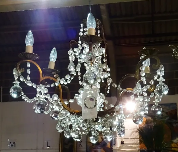 A pair of 20th century brass and glass six branch chandeliers with glass drops. (2) HANG
