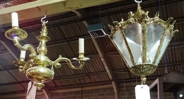 A 20th century brass and glass hall lantern of tapering form and a 20th century Dutch style three branch brass chandelier. (2)  HANG