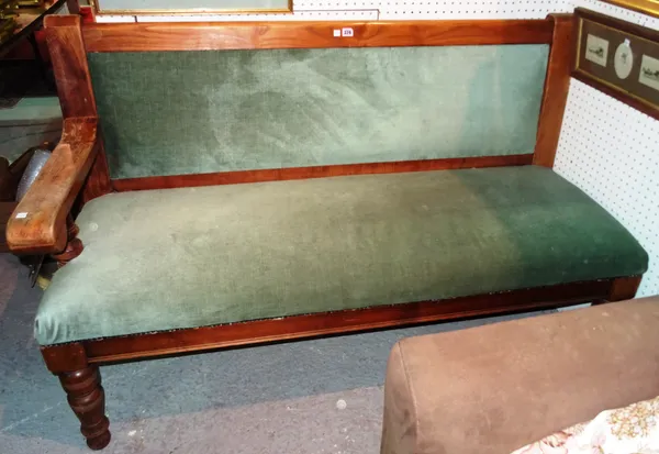 A 20th century oak railway bench, with green part upholstery, 151cm wide x 98cm high. ROST