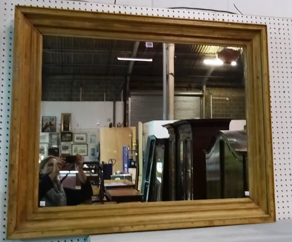 A 20th century rectangular pine mirror, 112cm wide x 92cm high. L10