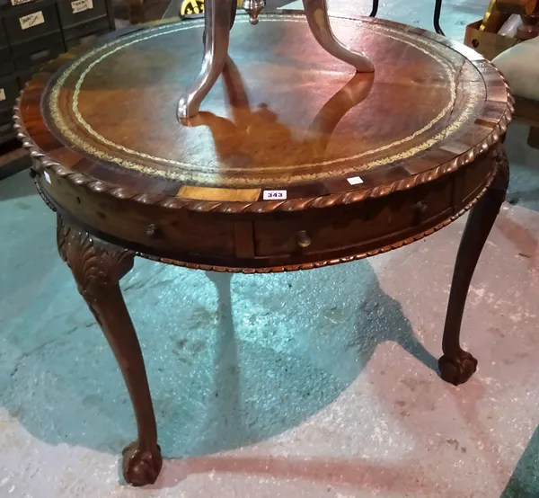 A 19th century mahogany drum table, with leather inset top, on ball and claw feet, 90cm wide x 71cm high. B8