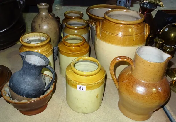 A quantity of large stoneware pots and jars, including a twin handled jardiniere, (qty).  S2