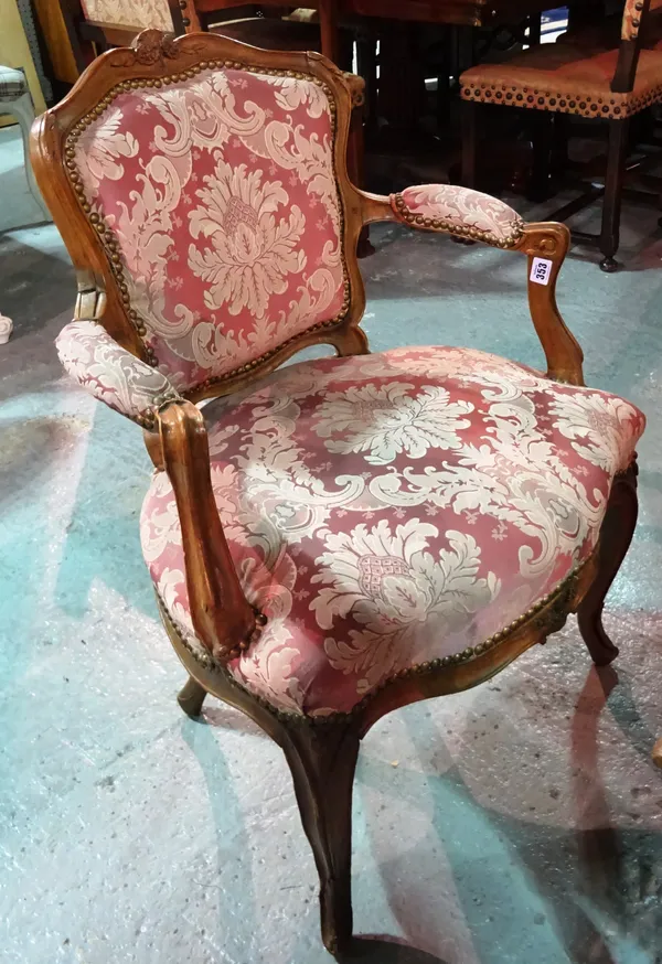 A pair of Louis XV style mahogany open armchairs, (2). E8