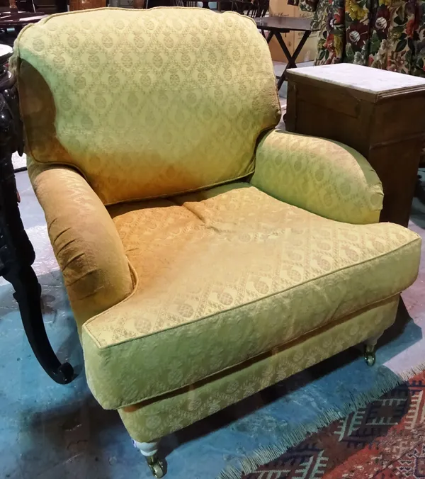 A 20th century yellow upholstered armchair. G5