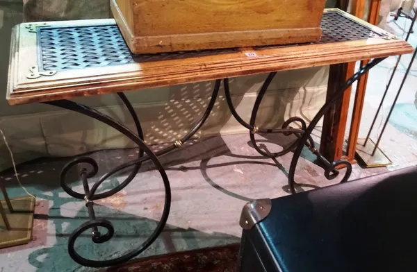 A 20th century stained pine and metal console table, on scroll supports, 128cm wide x 79cm high. F4