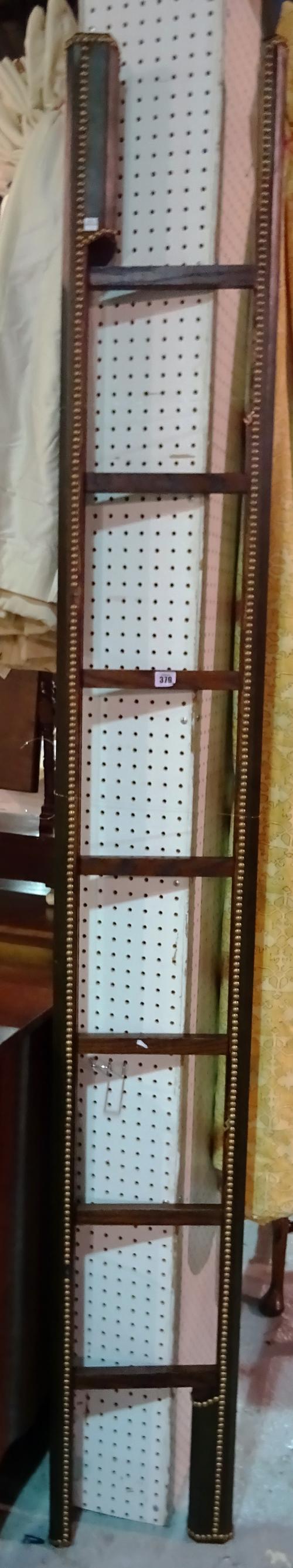 A 20th century folding library ladder, with green studded leather case, 232cm long.  C5