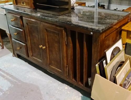 A 20th century mahogany and walnut kitchen island, with granite top over a cupboard base, with three drawers, 173cm wide x 90cm high.  K2