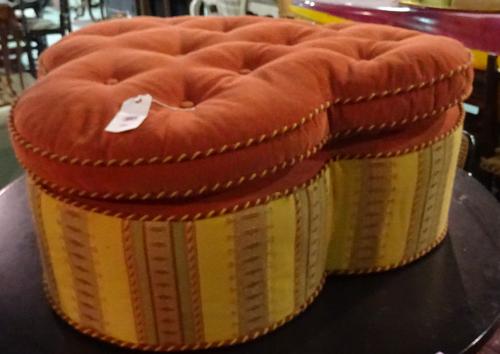A 20th century trefoil shaped upholstered centre stool, 112cm wide x 38cm high. G8