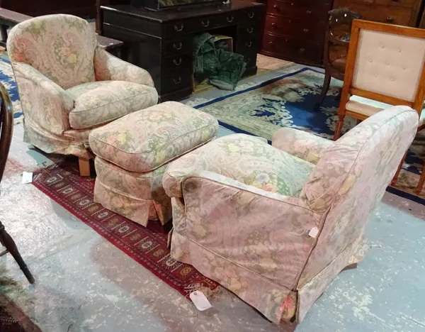 A pair of 20th century Howard style upholstered armchairs, together with a matching footstool, (3). H8