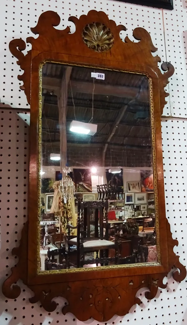A 19th century fret cut walnut framed wall mirror, with Hoho bird crest, 62cm wide x 110cm high, together with another similar 44cm wide x 77cm high,