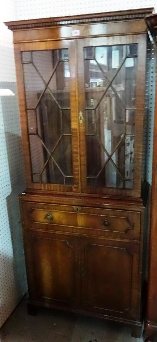 A 20th century mahogany floor standing bookcase, over a cupboard base, 75cm wide x 183cm high. M10