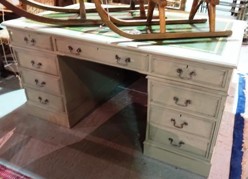 A 20th century grey painted pedestal desk, with green leather inset top, 151cm wide x 80cm high.  H8