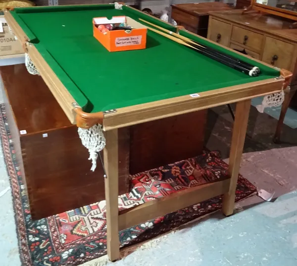 Riley of England, 6' x 3' snooker/pool table, with drop-down folding legs, together with two cues, a triangle, chalks and full set of resin snooker an