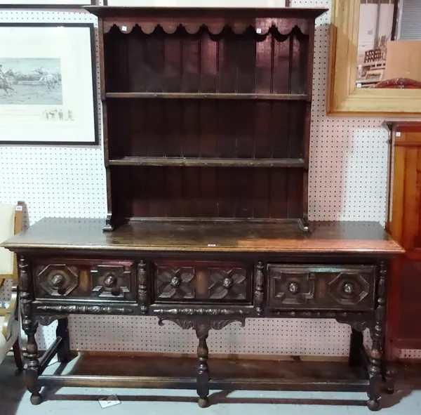 A 17th century style oak dresser base and associated smaller rack, 187cm wide x 80cm high.  H10
