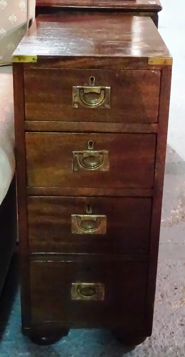 A mahogany four drawer campaign style bedside table, 32cm wide x 49cm deep. I5