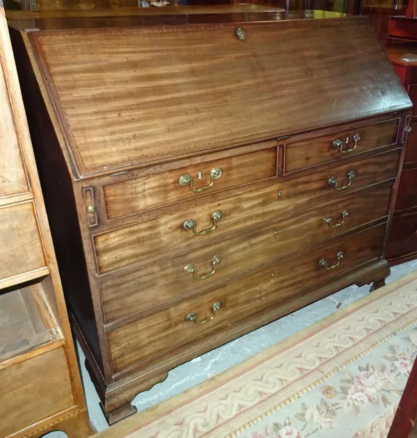 A 19th century mahogany bureau, the fitted interior over two short and three long drawers, on shaped bracket feet.  L8