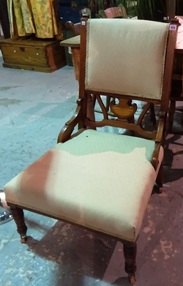 An Edwardian mahogany inlaid nursing chair.  I10
