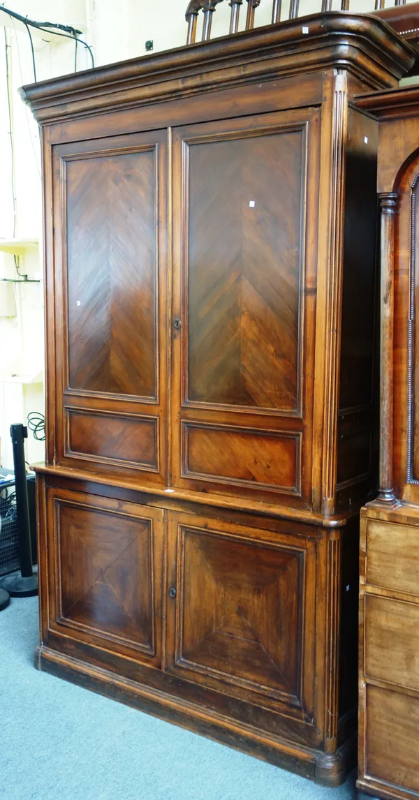 A 19th century French stained pine double height side cabinet, with two pairs of panel doors on plinth base, 157cm wide x 247cm high x 47cm deep.  G10