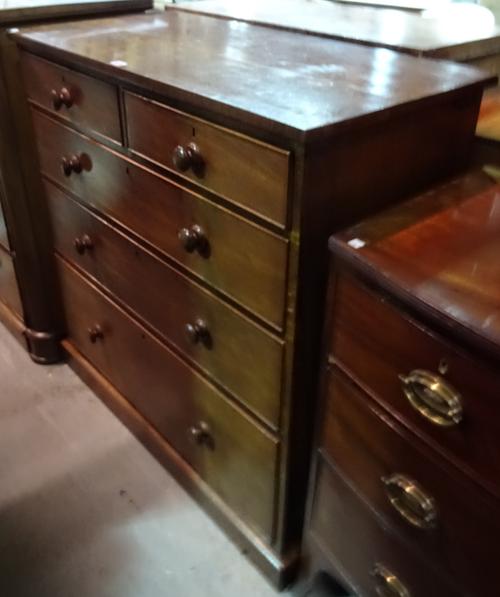 An early 19th century mahogany chest of two short and three long drawers, with bun handles, 104cm wide x 106cm high.  M7