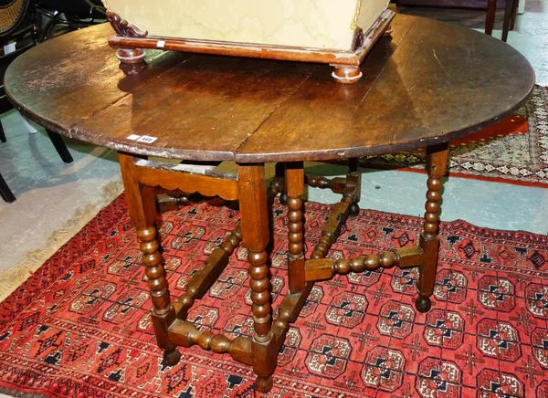 An 18th century and later oak gateleg table, 114cm wide x 78cm high.  G7