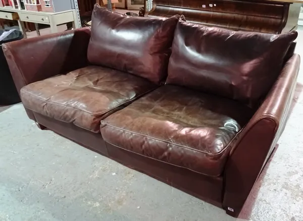 A 20th century brown leather two seat sofa, 200cm wide.  H3