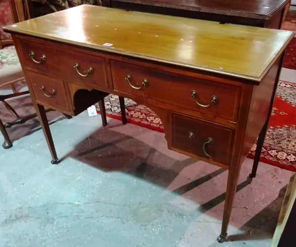 An Edwardian mahogany kneehole writing desk, on square tapering supports, 114cm wide x 81cm high.  E7