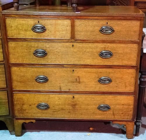 An early 19th century oak and mahogany chest of two short and three long drawers, on high bracket feet, 101cm long x 104cm high.  L6