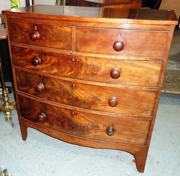 An early 19th century mahogany bowfront chest of two short and three long drawers, on high bracket feet, 102cm wide x 105cm high.  M6